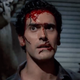 Bruce Campbell as a bloody-faced Ash Williams in Evil Dead II.